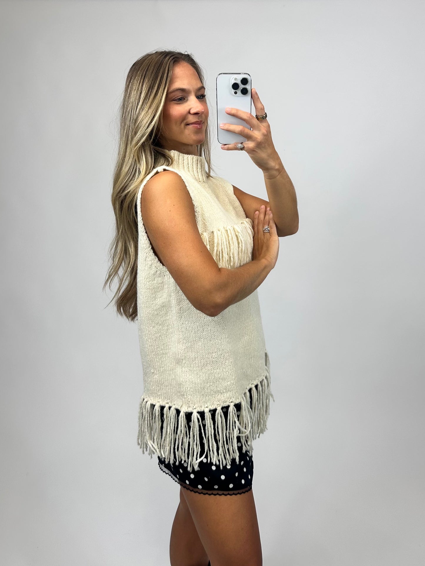 cream sleeveless fringe turtleneck sweater